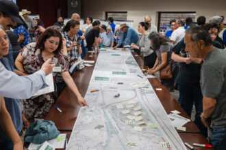 Dozens of people attend TxDOT’s public meeting on possible highway expansion near the Rio Bosque Wetlands Park in El Paso, Texas on May 2. Credit: Justin Hamel for The Texas Tribune/Inside Climate News