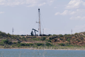 A view of an oil well adjacent to the Red Bluff Reservoir in Reeves County, Texas on Feb. 24, 2020. NGL Water Solutions Permian has proposed to discharge treated produced water into the reservoir. Credit: Justin Hamel