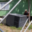 Workers remove an AC unit from a mobile home in order to tow it out of Congress Mobile Home Park in Austin, Texas, on Aug. 29, 2022. Credit: Evan L'Roy/The Texas Tribune