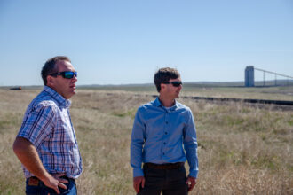 Rusty Bell, director of Gillette College’s Office of Economic Transformation, and Justin Loyka, energy program director with the Nature Conservancy in Wyoming, discuss potential solar sighting on coal mines near Gillette, Wyo. Credit: Jake Bolster/Inside Climate News