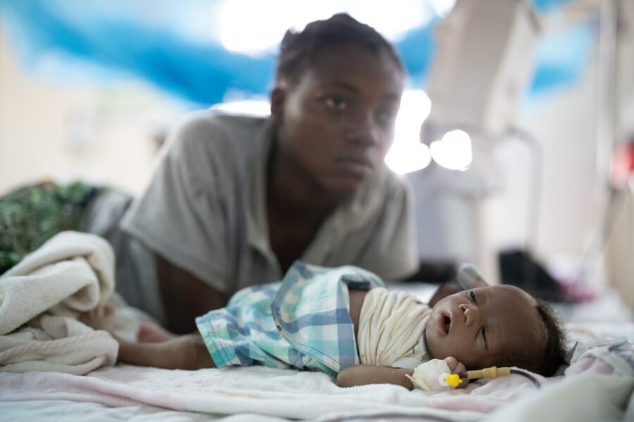 Families come to the Ammusait General Hospital malnutrition ward to tend to their sick children and family members. Staff is limited so family members become caretakers at the hospital. Credit: Larry C. Price