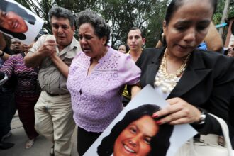 Relatives of murdered indigenous activist Berta Caceres cry on March 3, 2016. Credit: Orlando Sierra/AFP via Getty Images