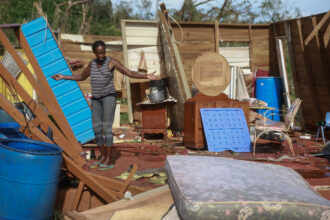 Olive Rowe stands in her home after it was destroyed when Hurricane Beryl struck Saint Elizabeth Parish, Jamaica on July 05, 2024. "Everything is gone," she said, "everything is gone." Hurricane Beryl made landfall in Mexico after devastating several Caribbean islands, including Jamaica. The hurricane is expected to make another landfall in Texas by Monday morning. Credit: Joe Raedle/Getty Images