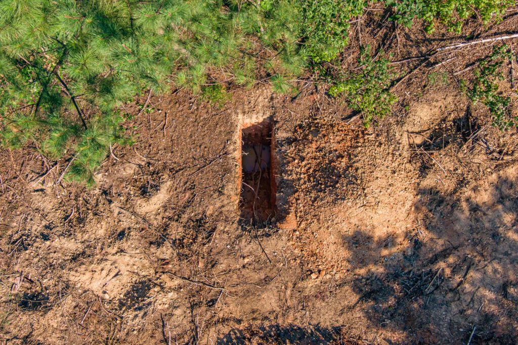 An aerial view of one small pit on the site in mid-July. Credit: Lee Hedgepeth/Inside Climate News