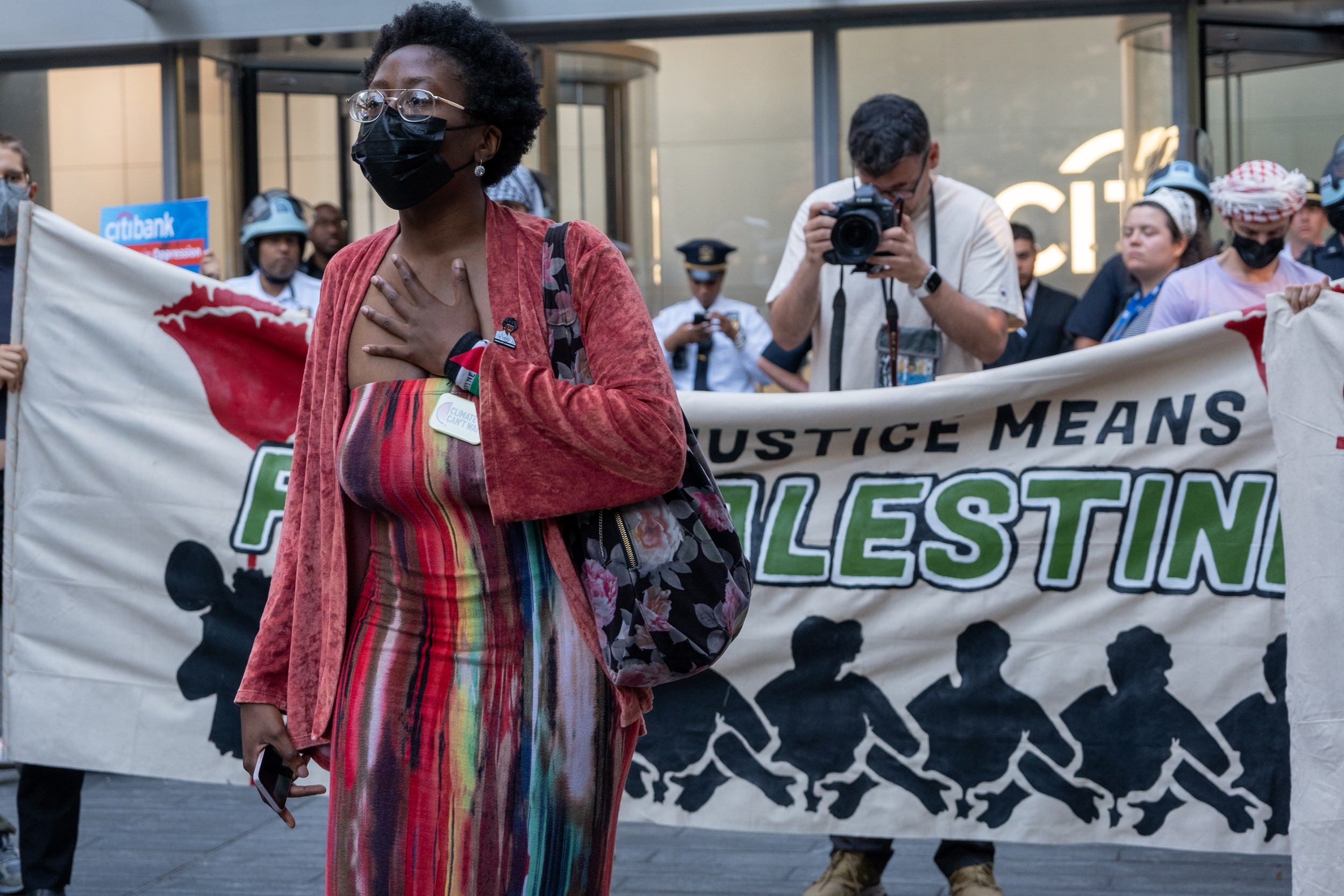 Fridays for Future activist Adérìnsolá Babawale leads a chant at Tuesday's rally. Credit: Keerti Gopal/Inside Climate News