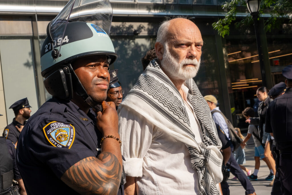 The New York Police Department arrested 23 activists on Friday morning with charges pending. Credit: Keerti Gopal/Inside Climate News