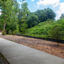 Part of the Bolin Creek Greenway in Chapel Hill, North Carolina, runs along a mound of coal ash behind a fence. Credit: Lisa Sorg/Inside Climate News