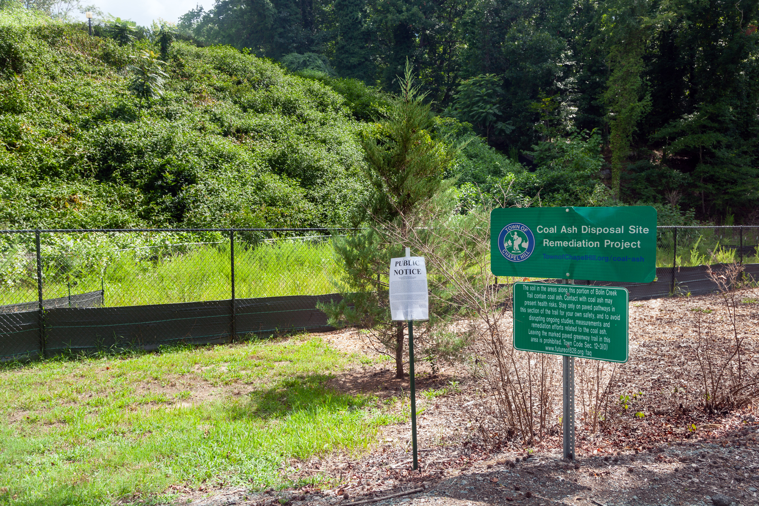 The Town of Chapel Hill has been grappling with the coal ash next to the Bolin Creek Greenway since 2013. Contractors have removed some of the ash, but 46,000 tons remain. Credit: Lisa Sorg/Inside Climate News