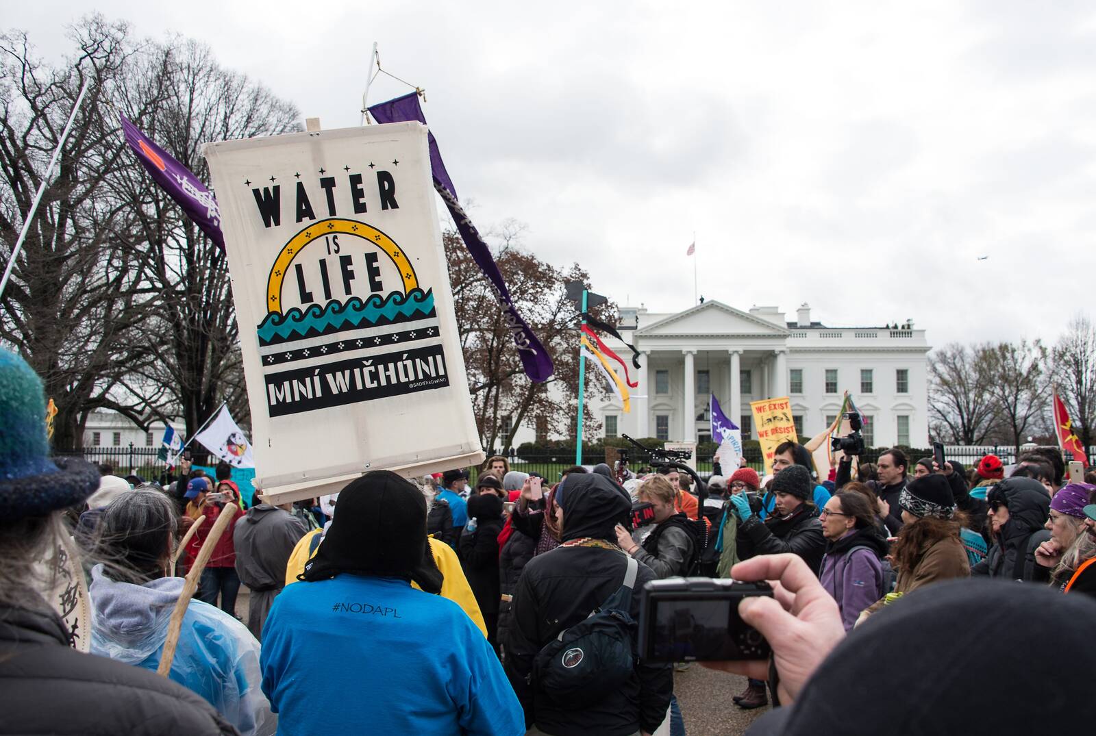 People gather in front of the White House during the Native Nations Rise protest in Washington on March 10, 2017. Native tribes from around the U.S. gathered for four days to protest the Trump administration and the Dakota Access oil pipeline. Credit: Nicholas Kamm/AFP via Getty Images