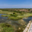 Stagnant water sits below the dry spillway of Falcon Dam in Starr County on Aug. 18, 2022. Credit: Michael Gonzalez/The Texas Tribune