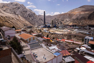 An aerial view of kids playing at a school near the metallurgical complex in La Oroya, Peru. Credit: Ernesto Benavides/AFP via Getty Images