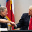 Texas Gov. Greg Abbott and former President Donald Trump shake hands during a briefing on June 30, 2021 in Weslaco, Texas. Credit: Brandon Bell/Getty Images