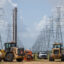 Service technicians work to install the foundation for a transmission tower at the CenterPoint Energy power plant on in Houston, Texas. Credit: Brandon Bell/Getty Images