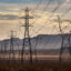 Heavy electrical transmission lines are located in California's Mojave Desert near the stateline community of Primm, Nevada. Credit: George Rose/Getty Images