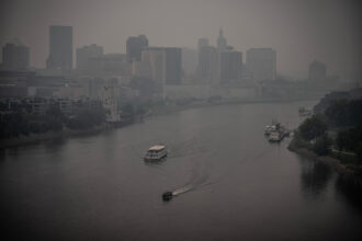 Heavy smoke from Canadian wildfires blankets downtown St. Paul, Minn. on June 14, 2023. Credit: Jerry Holt/Star Tribune via Getty Images