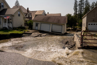 Homes throughout Barre, Vermont were inundated with flash flooding on July 11, 2023 after heavy rains across the state. Credit: John Tully/The Washington Post via Getty Images