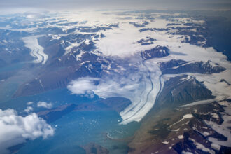 An aerial view of melting glaciers in Scoresby Fjord near Ittoqqortoormiit, Greenland on Aug. 21, 2023. Credit: Olivier Morin/AFP via Getty Images