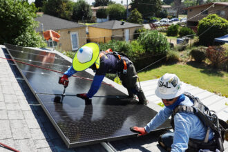 GRID Alternatives employees install no-cost solar panels on the rooftop of a low-income household on Oct. 19, 2023 in Pomona, Calif. Credit: Mario Tama/Getty Images