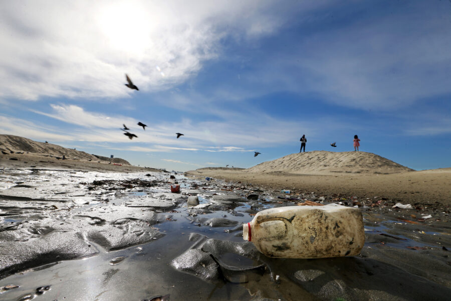 Plastic debris litters a drainage ditch to the sea at Junipero Beach in Long Beach, Calif. Credit: Luis Sinco/Los Angeles Times via Getty Images