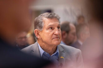 Sen. Joe Manchin waits to be introduced during an event at Saint Anselm College on Jan. 12, 2024 in Manchester, New Hampshire. Credit: Scott Eisen/Getty Images