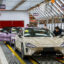 Employees work on the production line at Xiaomi's electric vehicle plant on March 25 in Beijing, China. Last year, 37 percent of new cars sold in China were electric and that figure could climb to 45 percent this year. Credit: VCG via Getty Images