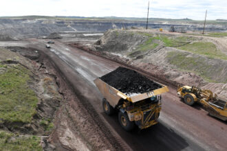 A truck loaded with coal drives away from the Eagle Butte Coal Mine in the Powder River basin. Credit: Matt McClain/The Washington Post via Getty Images