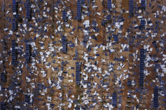 Debris is scattered throughout a solar panel field in the aftermath of Hurricane Maria in Humacao, Puerto Rico on Oct. 2, 2017. Credit: Ricardo Arduengo/AFP via Getty Images