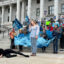 Sarah Woodbury leads a performance highlighting the migration of Wilson's phalarope during a rally to have the inland shorebird listed as threatened under the Endangered Species Act on March 28 in front of the Utah State Capitol. Credit: Wyatt Myskow/Inside Climate News