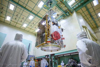 A team of scientists work on the PACE satellite in May 2023. Credit: NASA