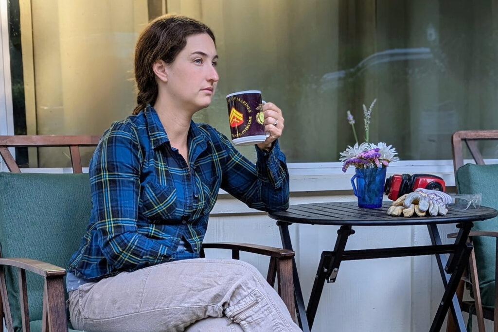 Jamie Lafollette, 35, sips coffee on the porch of her home in Santa Cruz, California, a community that has been deemed a high risk for wildfires. Lafollette is facing property insurance she can’t afford after her insurer for the past 10 years canceled her policy. Credit: Courtesy of Jamie Lafollette