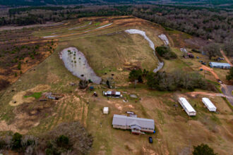 Even days after rainfall, water still pools on properties in the Shiloh community. Credit: Lee Hedgepeth/Inside Climate News