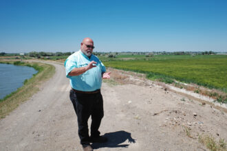Jay Barlogi, the general manager of the Twin Falls Canal Company, explains how water from the Snake River moves through irrigation canals on June 27. Credit: Daniel Rothberg/Inside Climate News