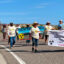 Residents and supporters walk southbound on New Mexico Highway 566 to the defunct uranium ore processing mill during the event on July 13 to remember the Church Rock uranium spill. Credit: Noel Lyn Smith/Inside Climate News