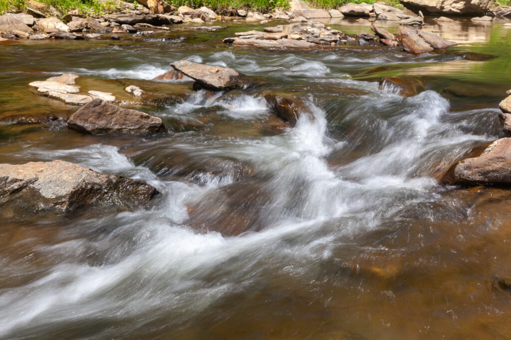 The Watauga River is 78.5 miles long, extending from its headwaters at Grandfather Mountain in North Carolina into Tennessee. 